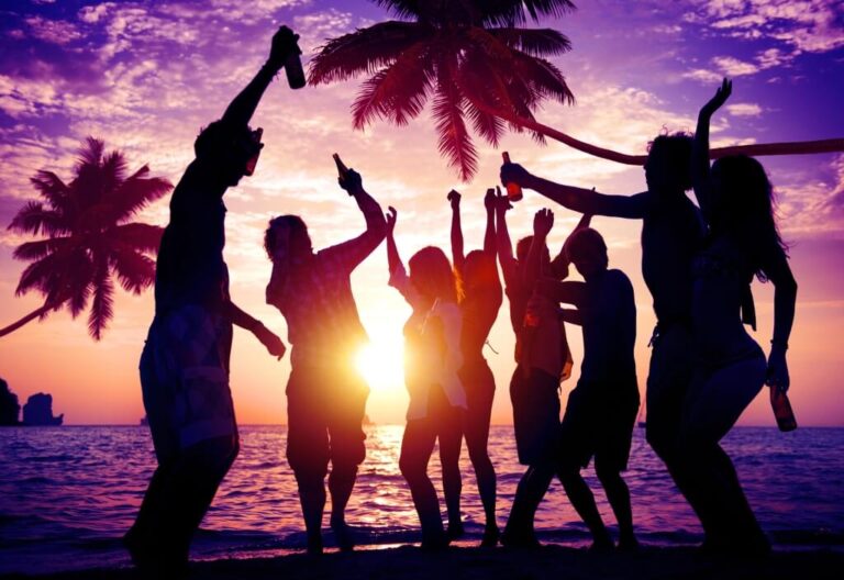 young group enjoying party near beach