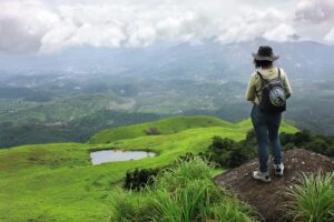 Girl standing near Chembra Peak our Trekking tour