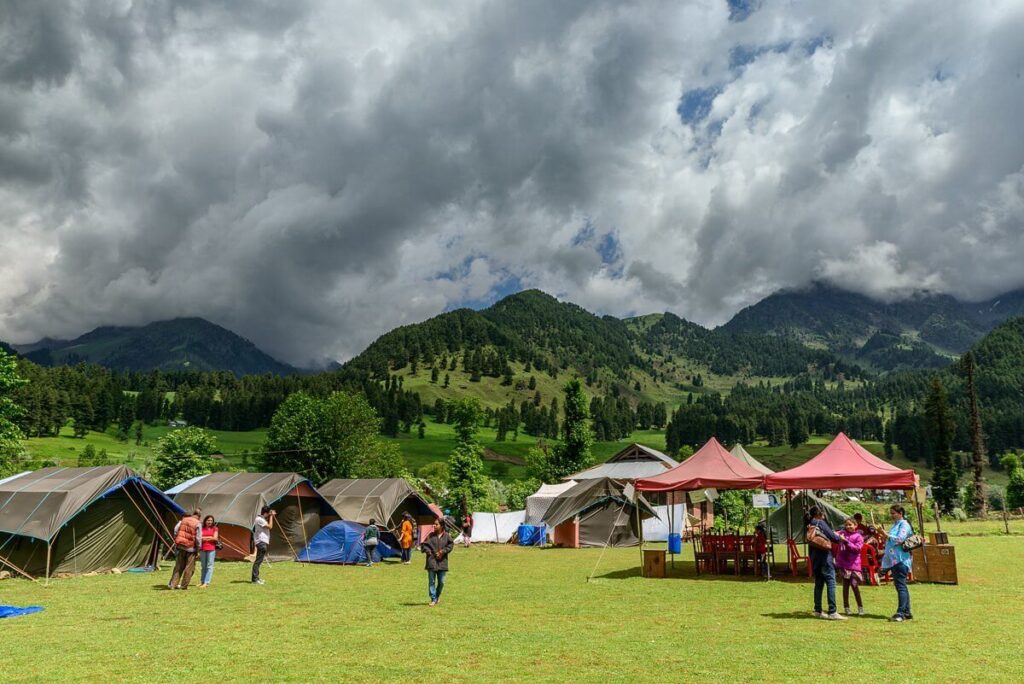 camping in lush meadows Aru Valley Kashmir