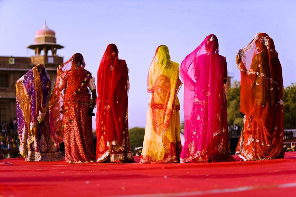 Women in India wearing colorful sari