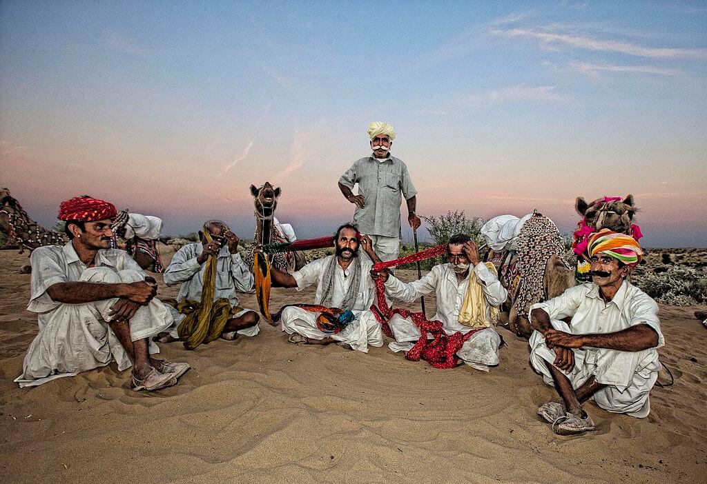 This state's enchantment may be found in the dunes, the energy of the folk music, and the history of the forts and palaces. With folded hands at the front of the chest, these guys say, "Namaste." Some areas of the state appear as if they have been taken from a bygone era, while others exude the flash and glamour of today's society. A trip to Rajasthan is a good idea for several reasons. Whether camping out in the desert or exploring the remnants of an ancient fort, each event has its distinct charm. The joys of "jook" buying and "dal-baati" eating are as diverse as they are intriguing. 10 Reasons Why You Should Travel To Rajasthan this Year 1. Awe-Inspiring Palaces And Forts Rajasthan stands apart from the rest of India because of its impressive collection of medieval forts and palaces. Each of the Rajput kingdoms that controlled this country had its distinct style of design and architecture that could be seen across the land. Explore Amer Fort by elephant, Jaisalmer, and Mehrangarh Forts' ramparts for panoramic vistas, or the City Palace in Jaipur for sheer luxury. These are only a few of the many architectural marvels out there! 2. Royal Palaces & Heritage Hotels Many of Rajasthan's former royal palaces have been converted into historic hotels, which provide a luxurious stay reminiscent of what the state's ancient kings and queens would have enjoyed. The most prominent historical hotels in the city are Umaid Bhawan Palace in Jodhpur, Taj Lake Palace at Udaipur, Rambagh Palace in Jaipur, and Samode Palace in Jaipur. If you've never been to Rajasthan, you're missing out on a royal experience. Take a look at the Rajasthan package: 9 Nights 10 Days Rajasthan Package Rajasthan Itinerary for 14 Days 15 Days Rajasthan Mumbai Goa Itinerary Rajasthan & Kerala Package 18 Days 6 NIghts 7 Days Rajasthan Package Rajasthan Itinerary 6 Days 4 Nights 5 Days Rajasthan Tour 3. Wildlife Of Many Kinds This regal state is a haven for outdoor enthusiasts. Wildlife from all over the world may be found in its vast and diverse terrain. It is a unique chance to get up close and personal with fantastic wildlife like tigers in Ranthambore National Park or Sariska Tiger Reserve, or endangered river dolphins and rare birds in Kumbhalgarh Wildlife Sanctuary, National Chambal Wildlife Sanctuary, or Keoladeo National Park. 4. Rajasthani Local Culture Rajasthan is unquestionably one of India's most culturally significant states. The colorful "angarakha" and "Ghaghara" garments worn by the locals are distinctive features of this region. Buttermilk, "khud khargosh" (rabbit meat), "dal baati churma," "gatte ki sabzi," etc., are some of the state's staple dishes. The primary source of food for the inhabitants of Rajasthan is farming, with the most common crops being wheat, bajra, and pulses. While Rajasthan retains much of its traditional charm, it also has a distinctly contemporary side, as seen by new shops and parks. 5. Rajasthani Traditional Dance And Art Are Viral Each tribe in this royal state has its dancing style, music, and art forms that contribute to the state's rich cultural heritage. Some may seem a little out of the ordinary, yet they all capture the essence of Rajasthani culture. When it comes to a Bhavai dance, for example, ladies wear eight to ten pitchers on their heads while dancing and gyrating to the music. Snake Charmer Dance or Kalbelia dance is the most prominent Rajasthani folk genre, wherein women do a dance and men play an instrument. People go to see the puppet-based Kathputli dance, adapted to local legends. Udaipur's Ghoomar dance, Kacchi Ghodi, Khayal dance, and Terah Taali are all well-known regional dances. 6. Local Traditional Shopping Rajasthan is one of the top shopping destinations in India. This is because shopping in this area is an excellent opportunity to learn more about the city's history and culture. Only Jaipur offers the best selection of ethnic handicrafts, arts & crafts, and fine antiquities. Johari Bazar & Bapu Bazar are two of the most significant locations to visit. If you are looking for everything from antiques to accessories, make your way to Jodhpur. The most excellent possibilities are Clock Tower Market or Nai Sarak. These two bazaars in Rajasthan are known for their unique products, including Rajasthani miniature paintings at Hathi Pol and Bada Bazar in Udaipur. Pushkar's Sadar Bazar is another fun shopping destination, where you can get anything from puppets to leather goods to textiles and more. 7. Stepwells Of Notoriety Like most of northern India, Rajasthan is plagued by water shortages, known as baori in the local language. They are striking step-wells conserved water in an eye-catching manner. Panna Mian ki Baoli near Amer is another well-known site. The Rani Ji Ki Baori & Nagar Sagar Kund near Bundi, as well as Christopher Nolan's depiction of the Abhaneri Chand Baori Prison in The Dark Knight Rises, are other well-known landmarks in the region. 8. Rajasthani Cuisine The distinctive climate and geography of Rajasthan have also influenced their food. Because of the lack of water and the arid environment, local cuisine has developed its unique characteristics. It's common to add a lot of dairies, but the main components are dry beans and lentils like jowar, bajra, or gram flour. All of the meals include large amounts of ghee. Non-vegetarian foods are just as popular as vegetarian options. "laal maas," "jungle maas," "safed maas," and "khargosh" are all examples of this kind of dish. 9. The Local People Something about the people of Rajasthan that makes exploring this arid area less daunting and more enjoyable than in any other Indian state. 'Atithi Devo Bhava'Â is Rajasthan's cultural ideal, and its people are typically kind and down-to-earth. If you're interested in learning about Rajasthani culture, customs, or art, you will find a welcome host in this state. 10. Beautiful Lakes In Rajasthan, there are several gorgeous lakes. Others enhance the attractiveness of the surrounding environment while serving as markers. Lake Pichola at Udaipur City, of course, is unsurpassed in terms of appeal. Jag Niwas & Jag Mandir are two artificial islands in a freshwater lake surrounded by a ring of artificial islands. Then there is Mount Abu's Nakki Lake, which is regarded as a holy site. It's also worth noting that India's most significant inland salt lake, Sambhar Salt Lake, is a major tourist attraction. Conclusion Tourists flock to Rajasthan, among the most popular destinations in India. We believe you will like some festivals here because of their rich cultural past, stunning forts and monuments, and other attractions. For further information, see Rajasthan: Places to See in Rajasthan in November Rajasthan Top 10 Destinations to Visit in August Top 10 Honeymoon Destinations in Rajasthan Rajasthan Tour in October Visit Famous Places Things to do in Rajasthan with Kids Top 10 Places in Rajasthan Visit in September 10 Popular Places to See Rajasthan in May Top 10 Famous Attractions to Visit Rajasthan in January 10 Famous Destinations to Visit in Bharatpur Top 10 Popular Attractions to See in Bundi